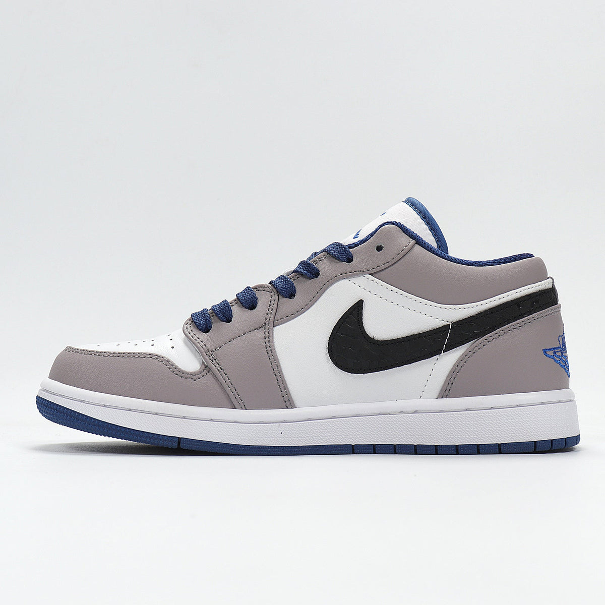Jordan 1 Low Sneakers in White Grey Blue 553558-103 - product image from the listing.