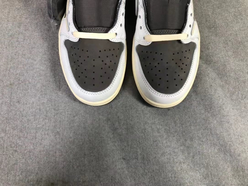 Travis Scott x Air Jordan 1 Low Sneakers in White Brown - product image from the listing.
