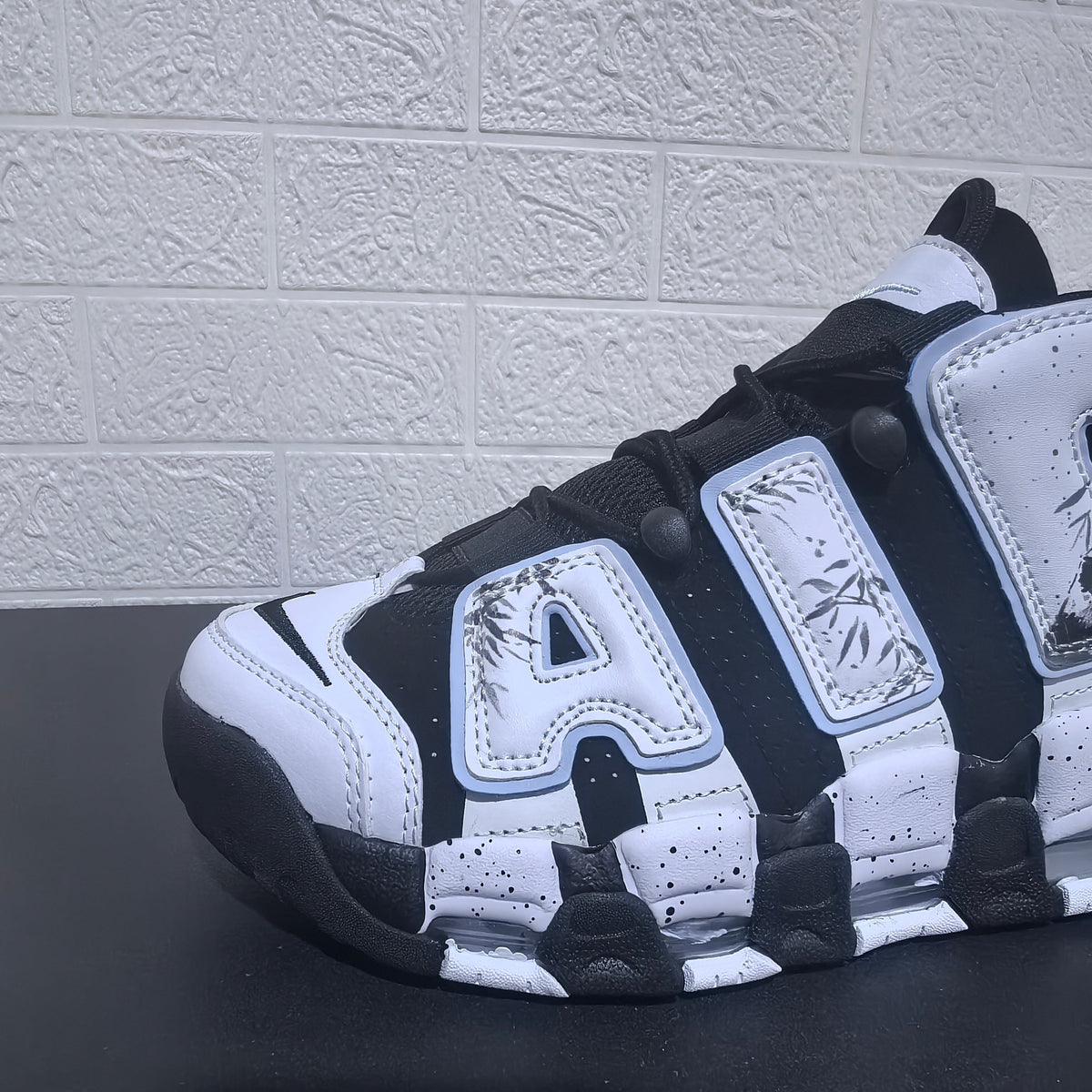 Nike Air More Uptempo Panda Sneakers in Black and White - product image from the listing.