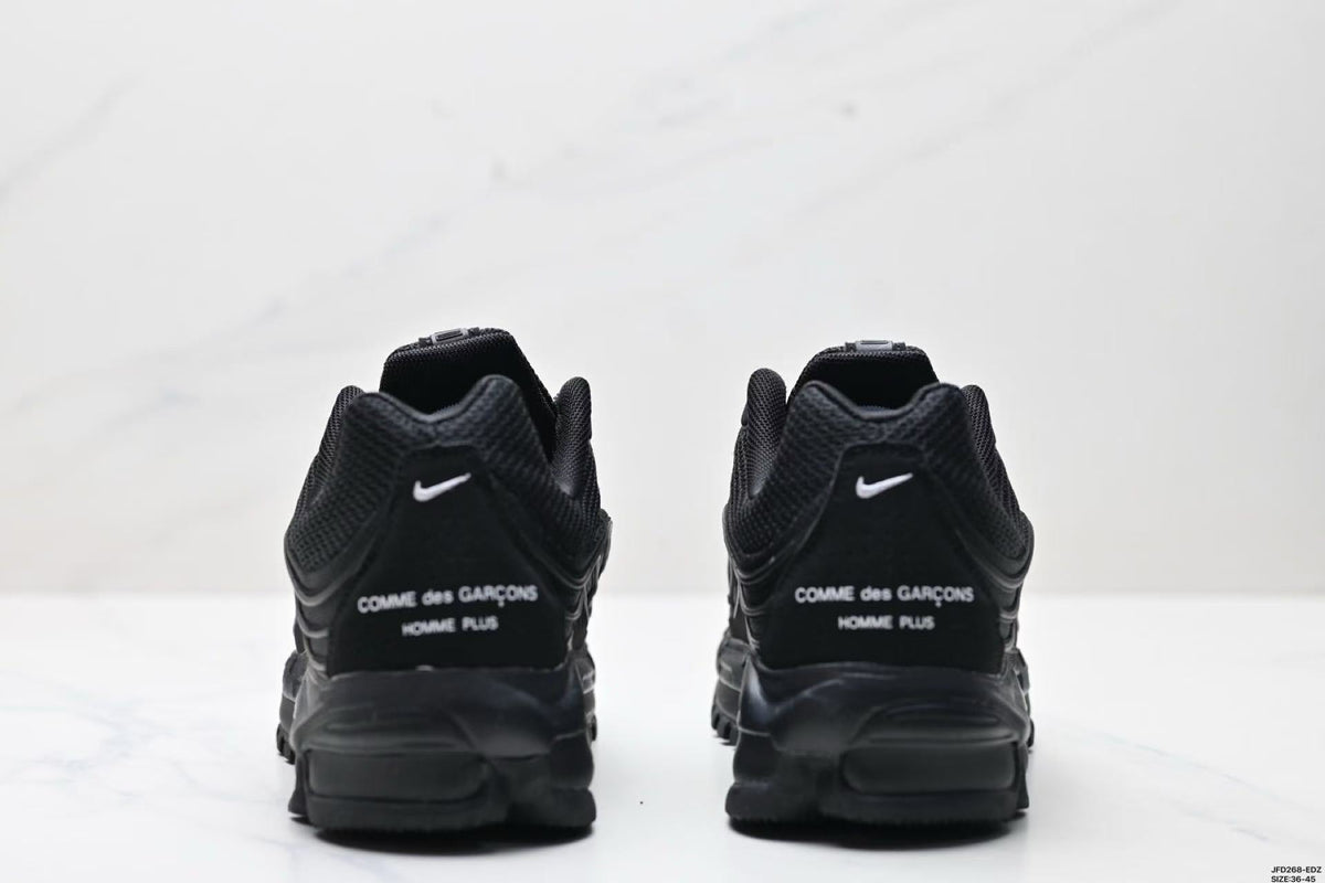 Nike Air Max Plus x Comme des Garçons Sneakers in Black - product image from the listing.