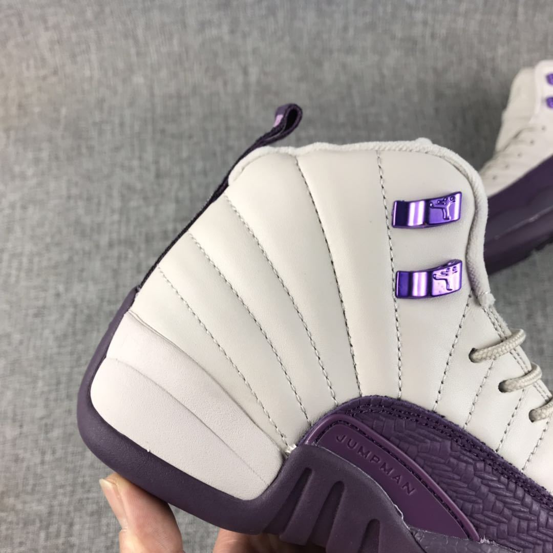 Air Jordan 12 White Purple Sneakers 510815-001 - product image from the listing.