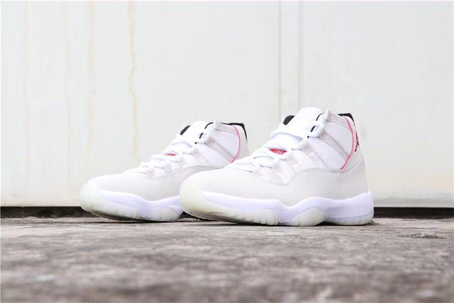 Air Jordan 11 Platinum Tint White High-Top Sneakers - product image from the listing.