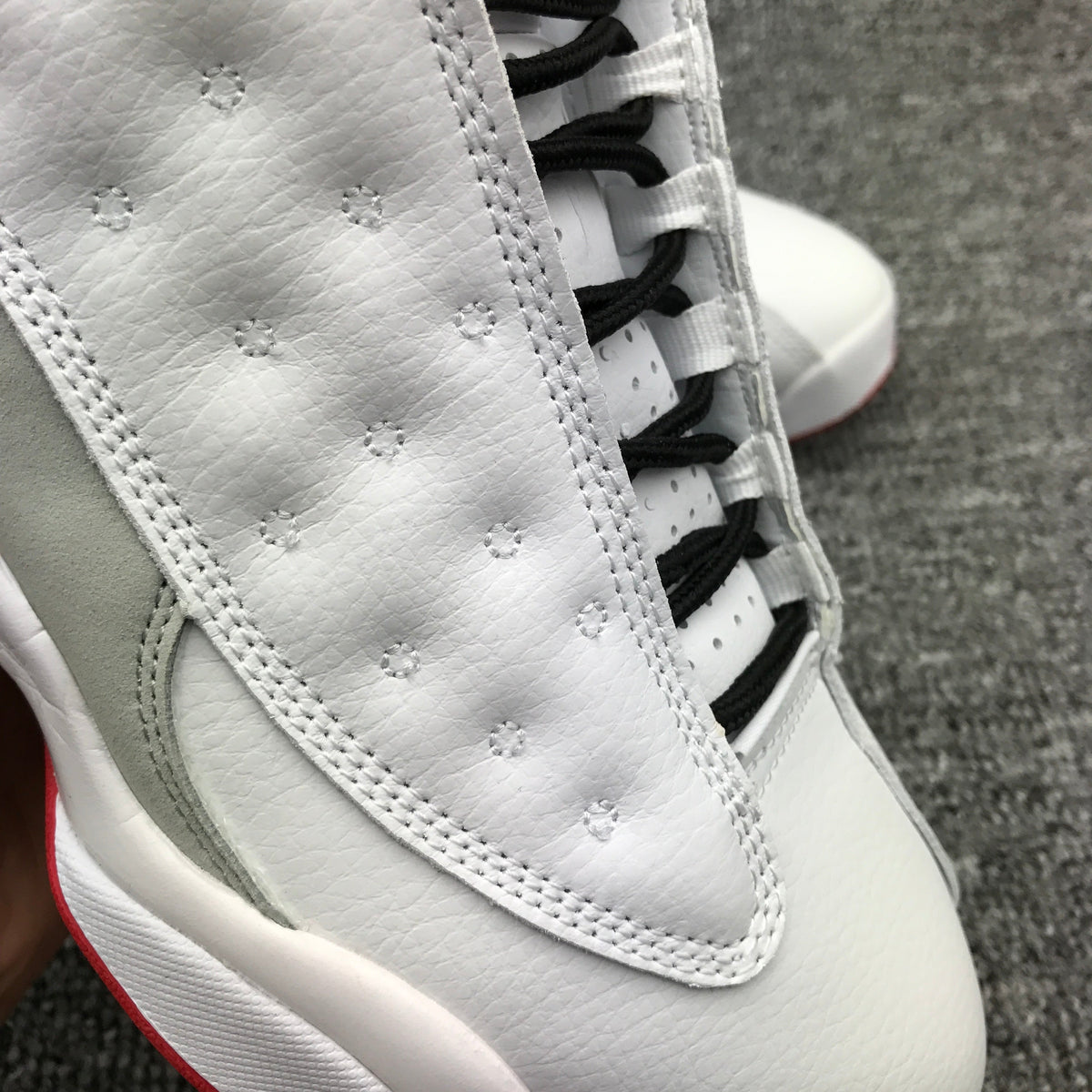 Air Jordan 13 High-Top Sneakers in White and Red - product image from the listing.
