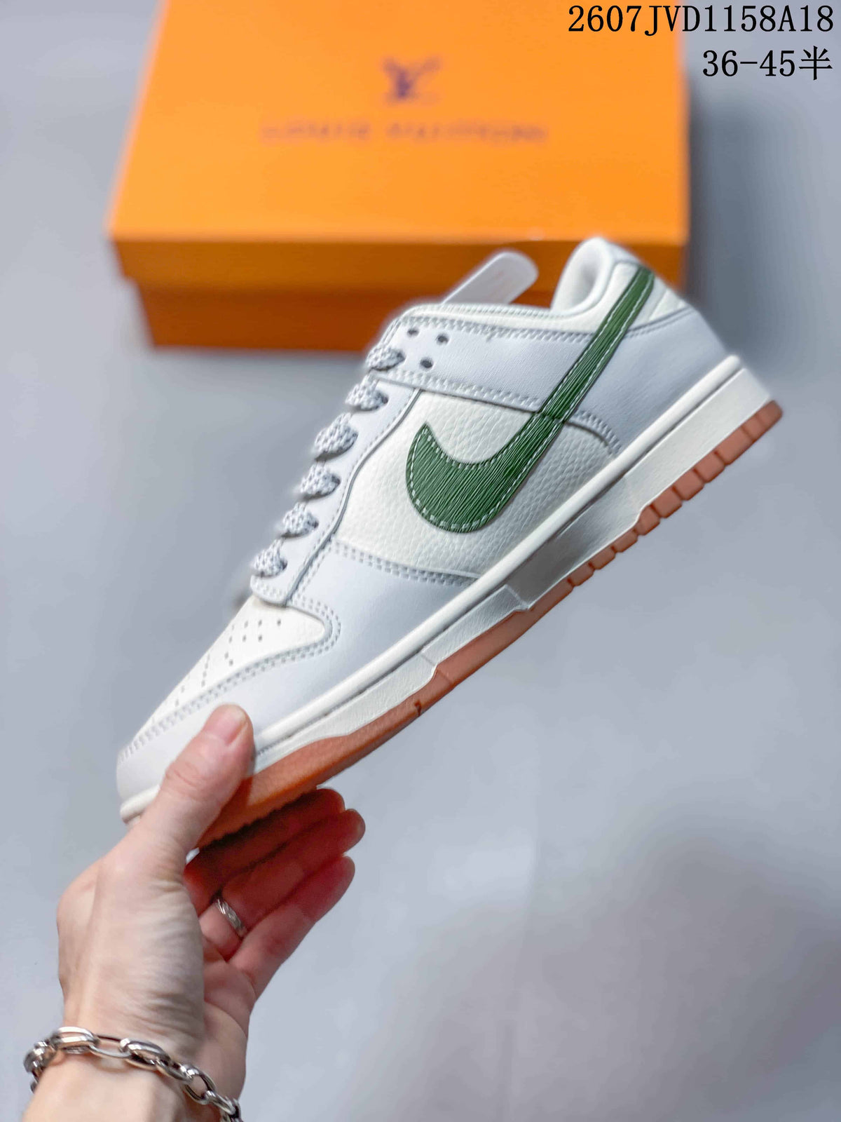 Nike SB Dunk Low Sneakers in White Green Gum 2607JVD1158A18 - product image from the listing.