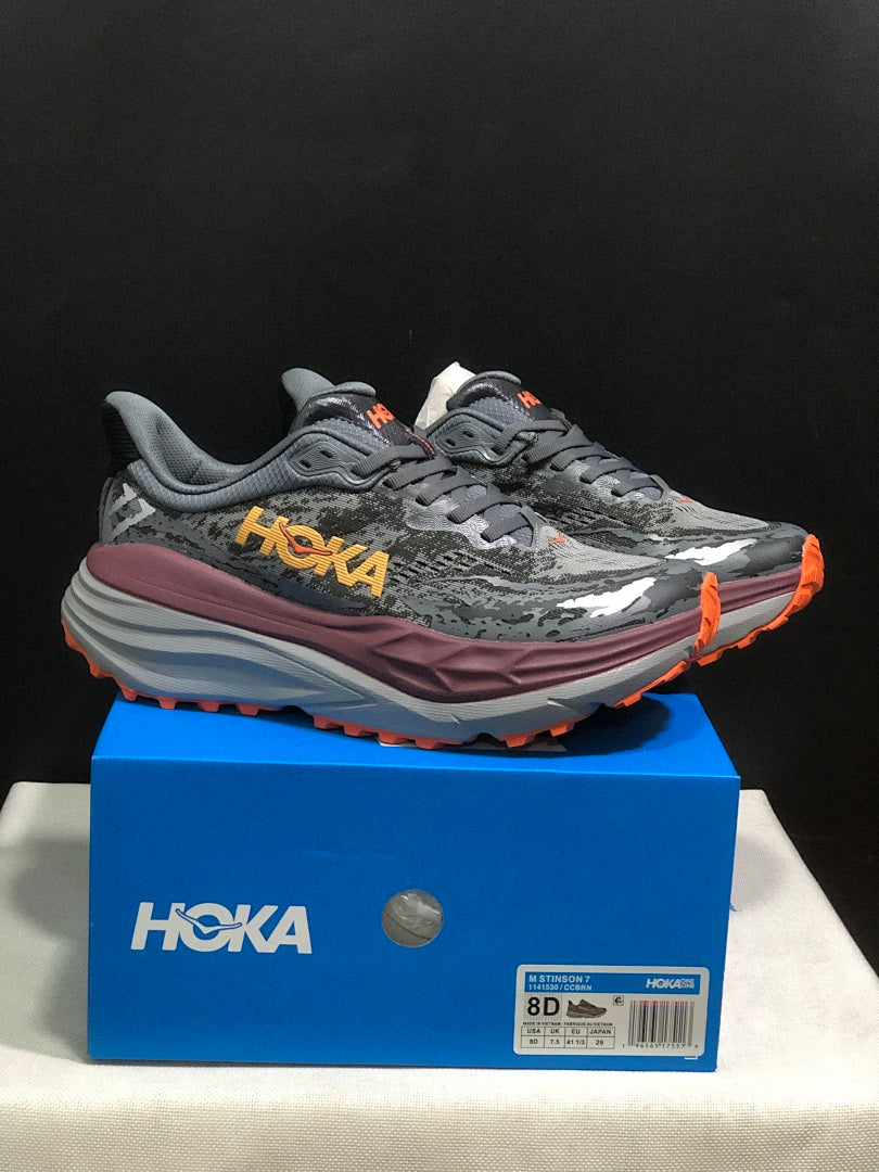 HOKA Stinson 7 Trail Running Shoes in Gray Orange - product image from the listing.