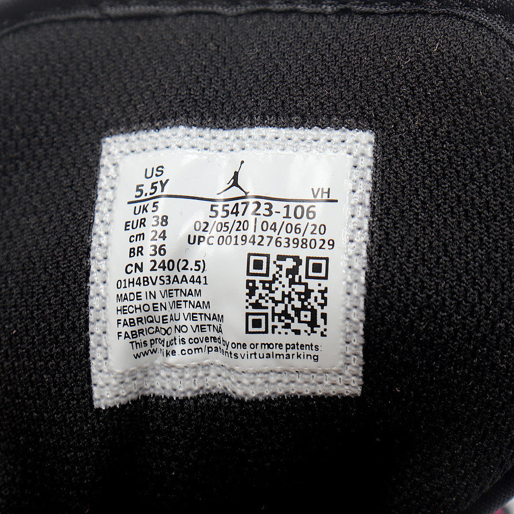 Jordan 1 Low Sneakers in Black Pink White 554723-106 - product image from the listing.