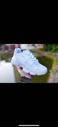 Nike White Mesh Trainers with Textured Sole - product image from the listing.