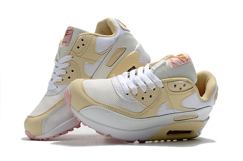 Women's Nike Air Max 90 Sneakers in Cream and Pink - product image from the listing.