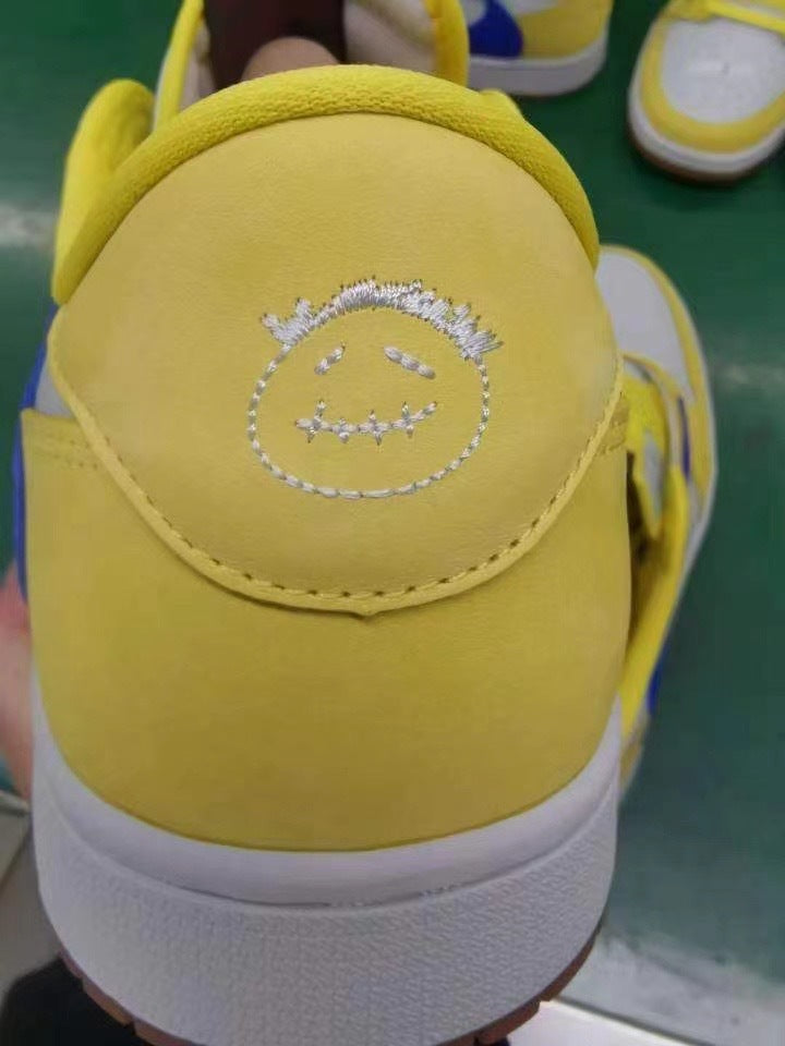 Jordan 1 Low Sneakers in Canary Yellow and Blue DZ4137-700 - product image from the listing.
