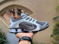 Grey and White Nike Shox Sneakers - product image from the listing.