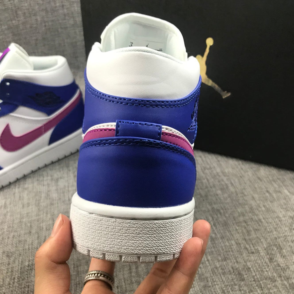Air Jordan 1 Mid Sneakers in Blue Pink 554724-451 - product image from the listing.