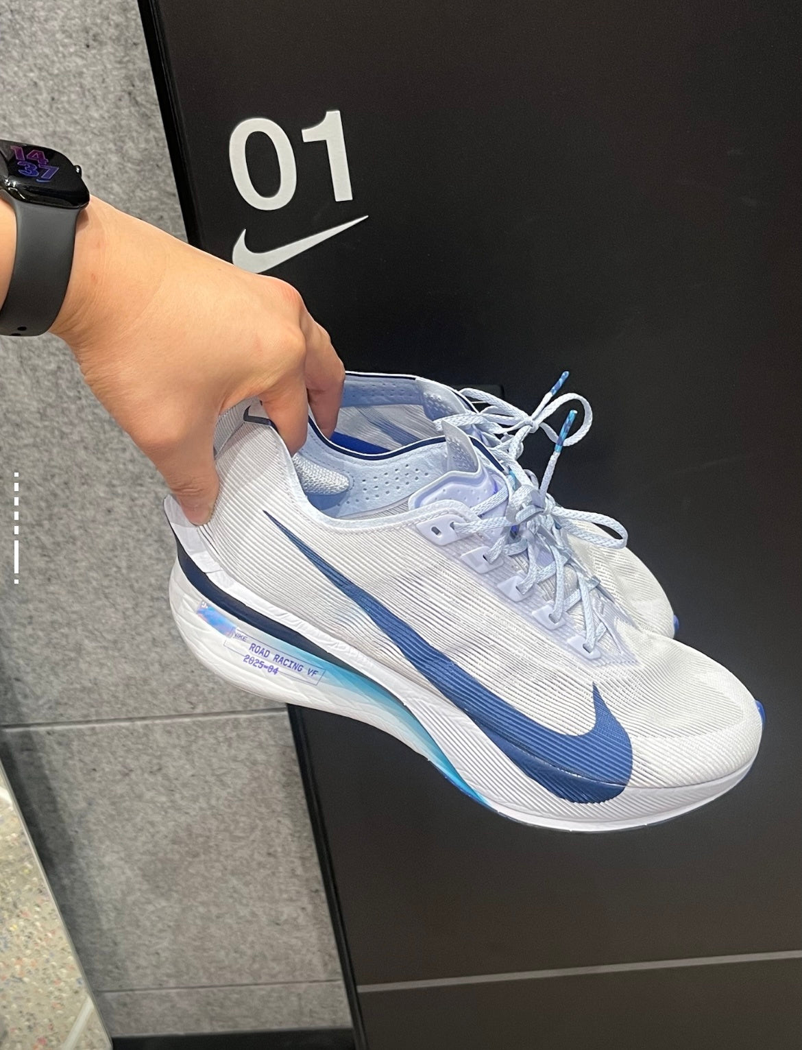 Nike Vaporfly Next% 4 Road Racing Shoes, in White and Blue HF6414-001 - product image from the listing.