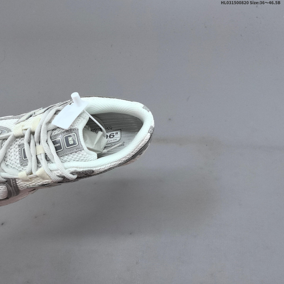 New Balance 1906R Sneakers in White Silver U1906RJM - product image from the listing.