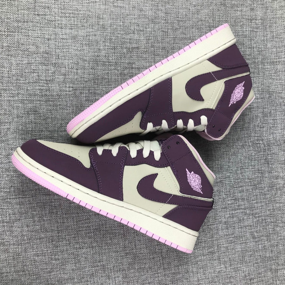 Air Jordan 1 Mid GS Sneakers in White Purple Pink - product image from the listing.