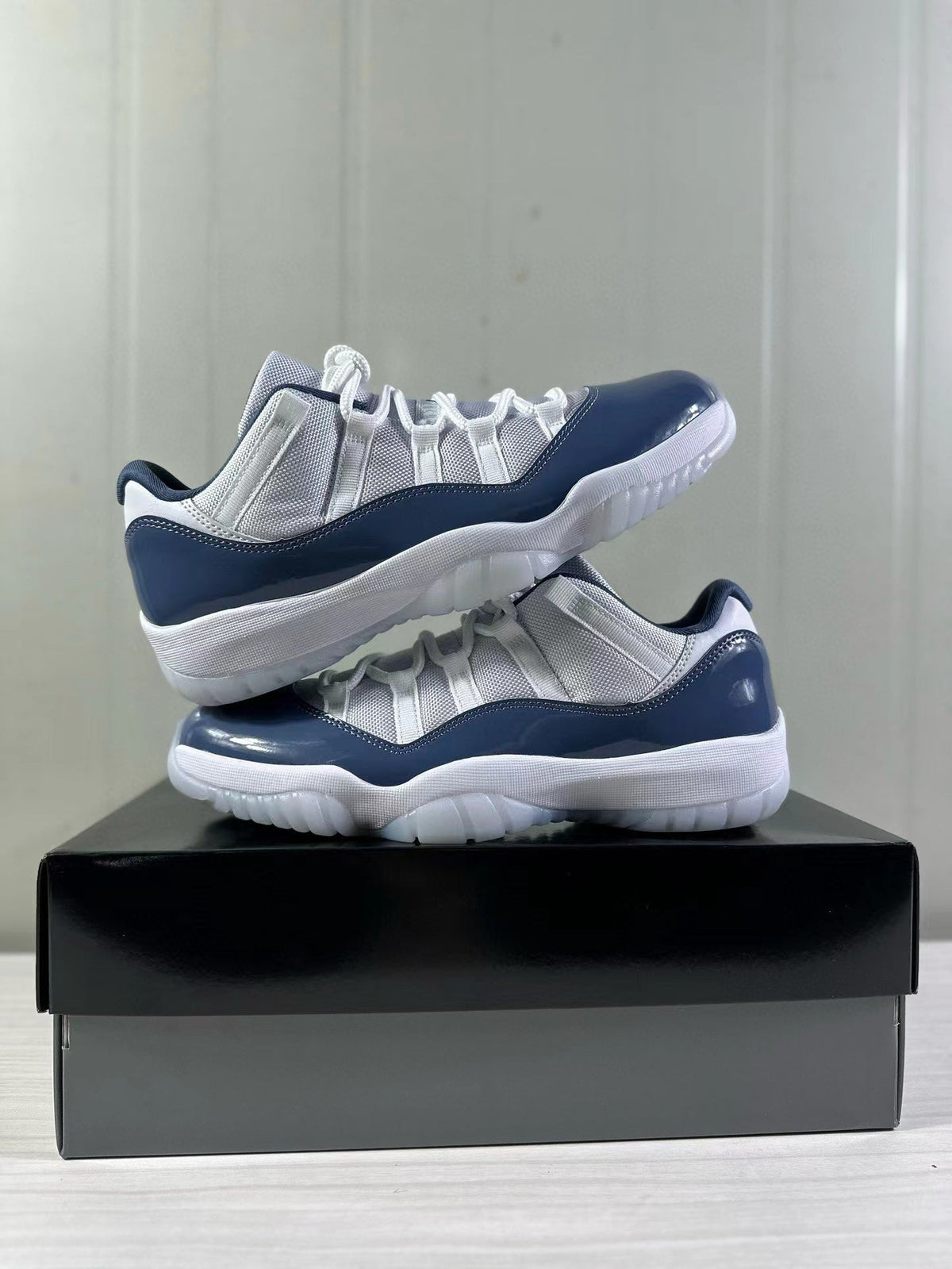 Air Jordan 11 Low Diffused Blue Sneakers FV5104-104 - product image from the listing.