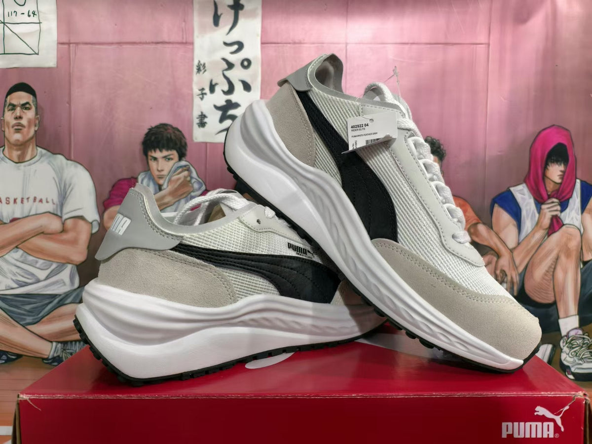PUMA White and Black Running-Style Trainers - product image from the listing.