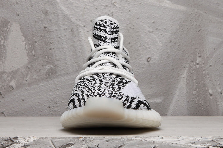 Yeezy 350 V2 Sneakers in Black and White Knit - product image from the listing.
