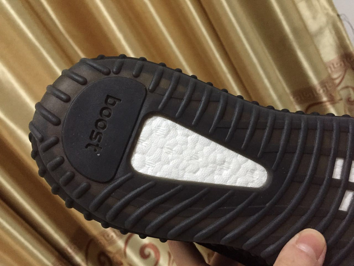 Adidas Yeezy Boost 350 V2 Sneakers in Black White - product image from the listing.
