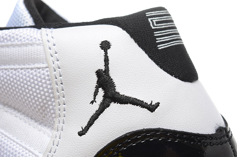 Air Jordan 11 Retro High White and Black Sneakers - product image from the listing.