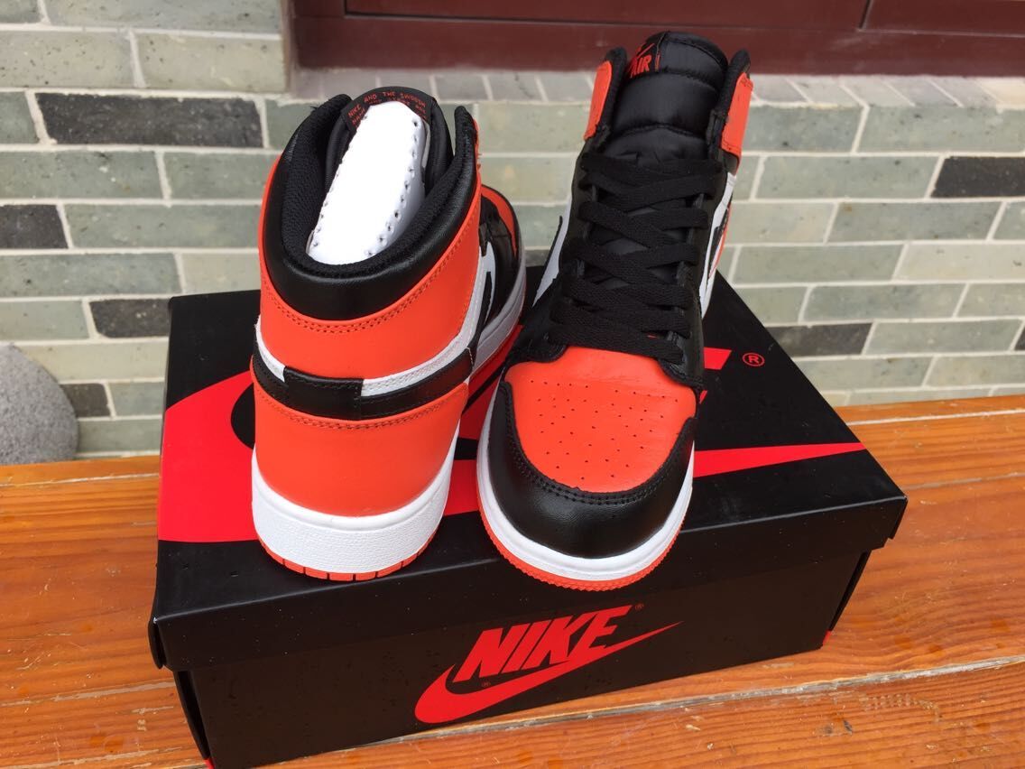 Women's Jordan 1 High Black Orange White Sneakers - product image from the listing.