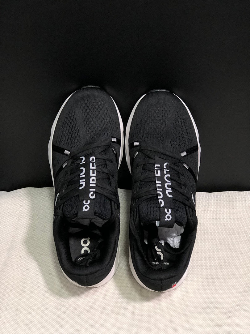 On Cloudsurfer Running Shoes in Black and White - product image from the listing.