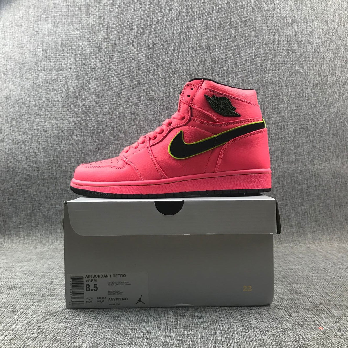 Air Jordan 1 Mid Sneakers in Pink Black Volt AQ9131-600 - product image from the listing.
