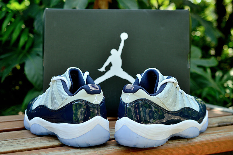 Air Jordan 11 Retro Low Sneakers, White and Navy - product image from the listing.