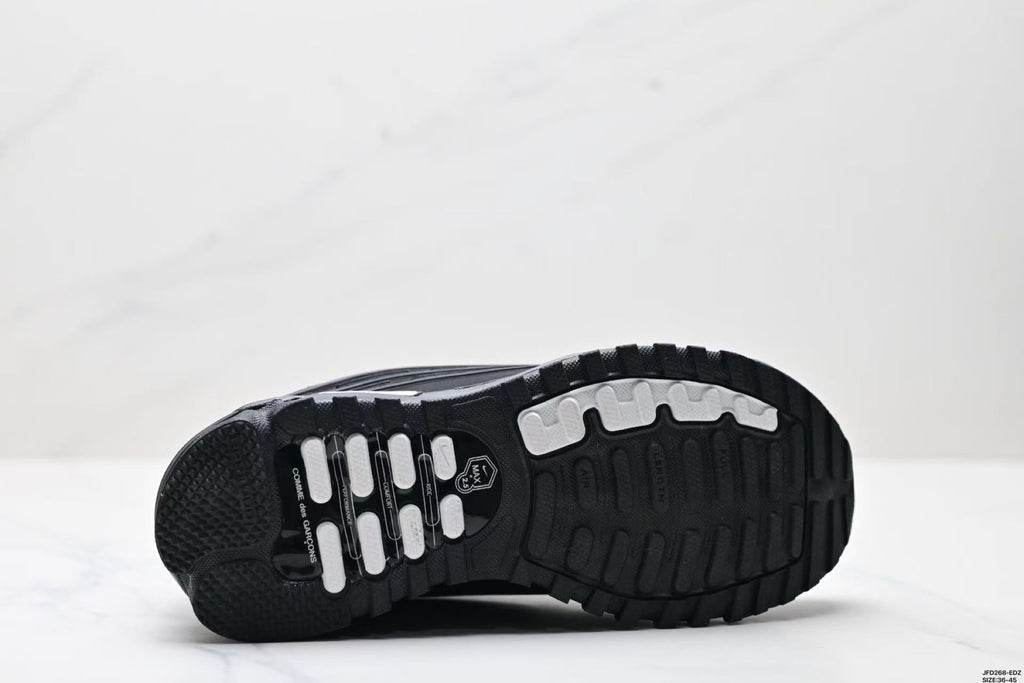 Nike Air Max Plus x Comme des Garçons Sneakers in Black - product image from the listing.