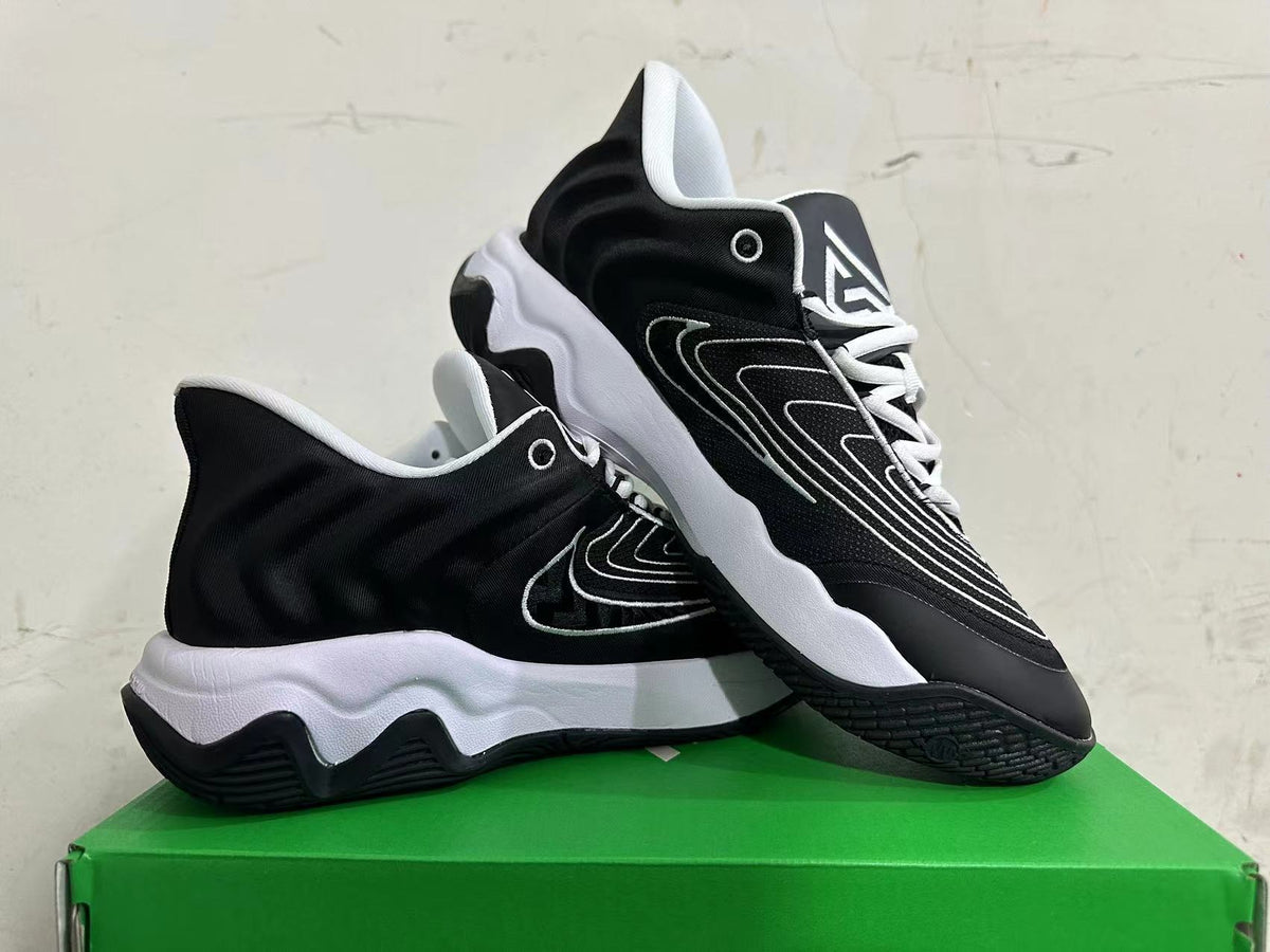 Nike Basketball Sneakers in Black and White - product image from the listing.