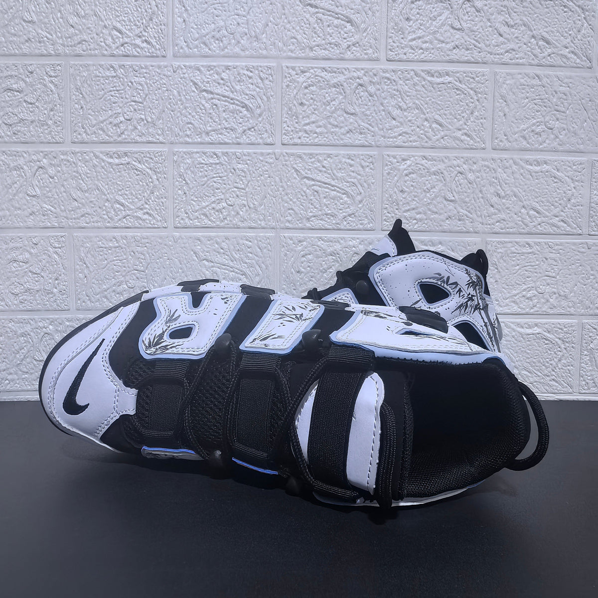Nike Air More Uptempo Panda Sneakers in Black and White - product image from the listing.