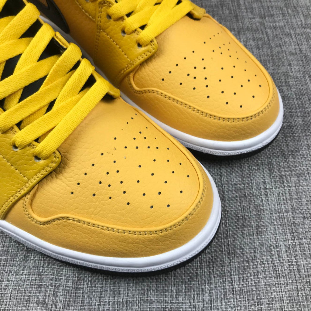 Air Jordan 1 Mid Yellow Ochre Sneakers in Black 554724-700 - product image from the listing.