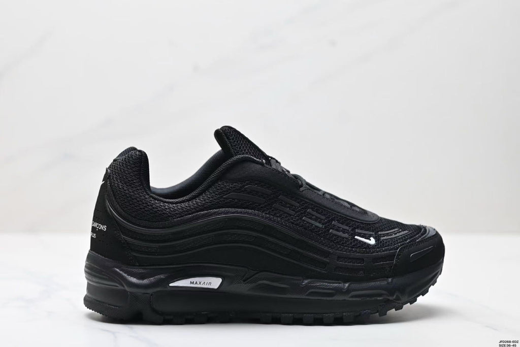 Nike Air Max Plus x Comme des Garçons Sneakers in Black - product image from the listing.