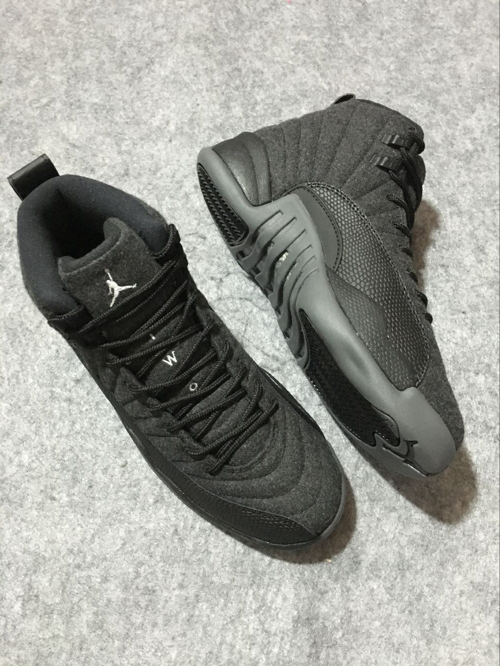 Black and Grey Air Jordan 12 High-Top Sneakers - product image from the listing.