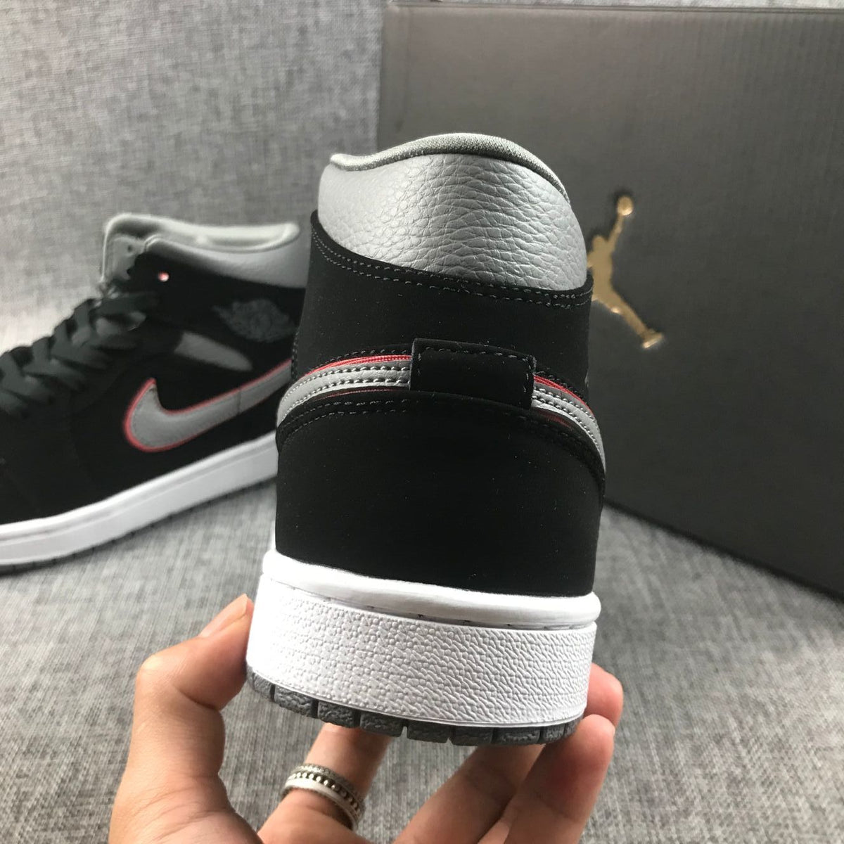Air Jordan 1 Mid Sneakers in Black Grey Red 554724-060 - product image from the listing.