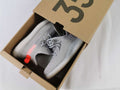 Light Grey and Coral Yeezy 350 V2 Kids Sneakers - product image from the listing.