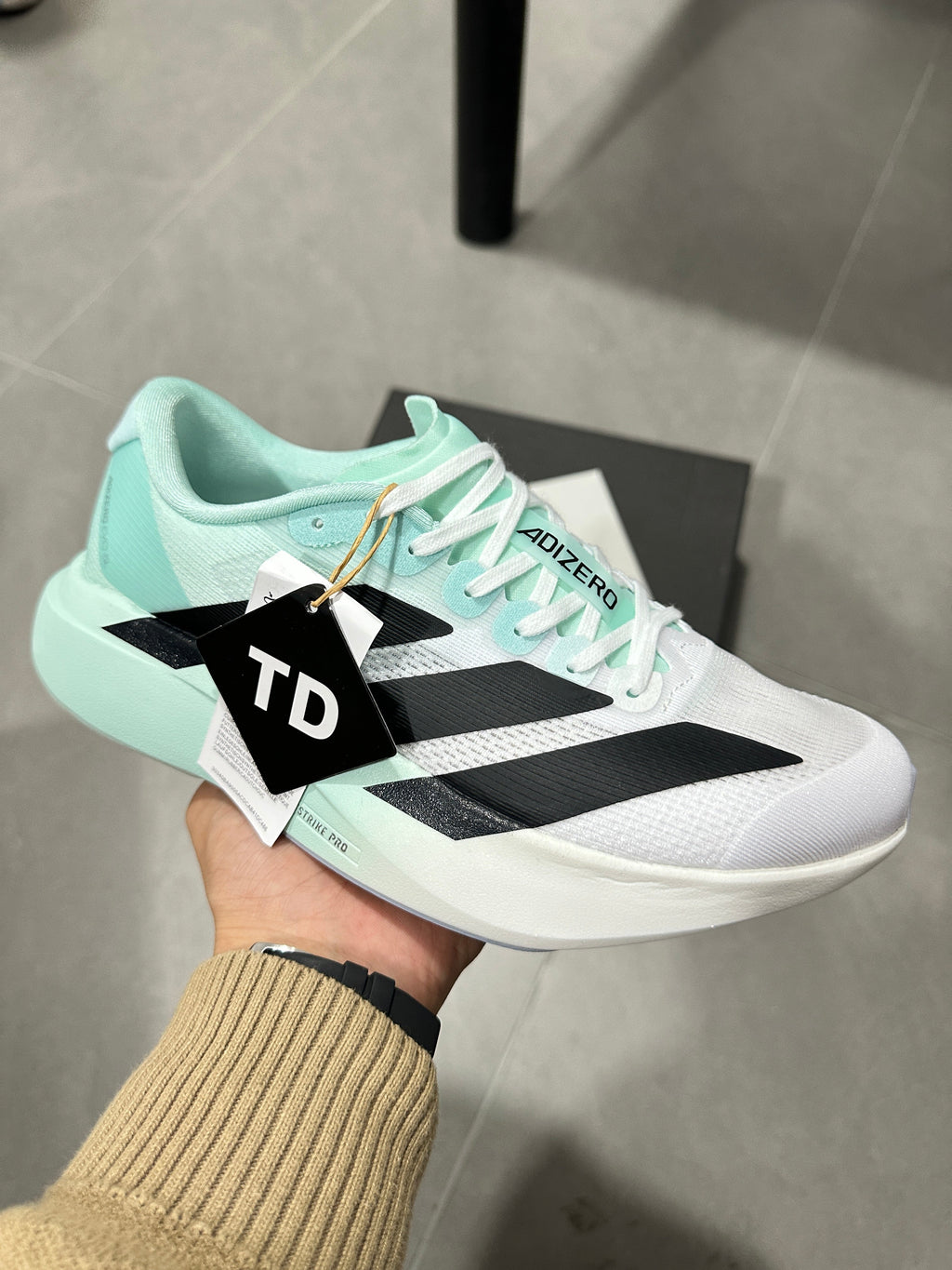 White and Mint adidas Adizero Lightweight Running Shoes - product image from the listing.