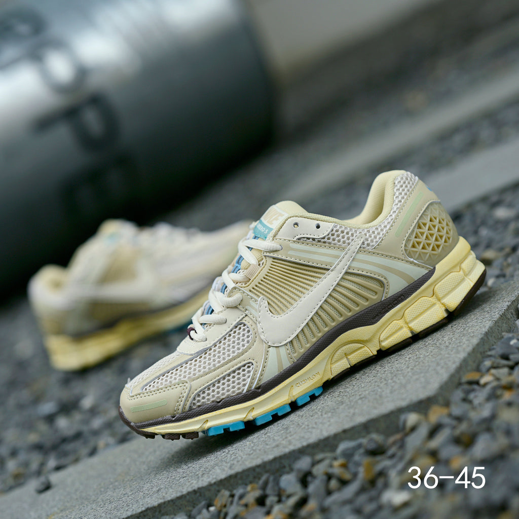 Pale Green and Blue Nike Air Zoom Vomero 5 Sneakers - product image from the listing.