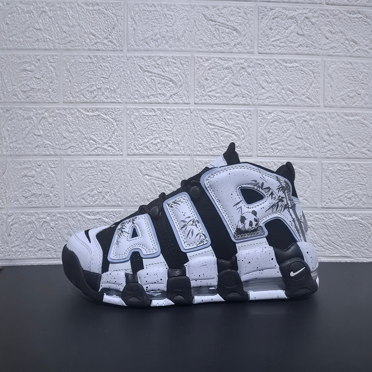 Nike Air More Uptempo Panda Sneakers in Black and White - product image from the listing.