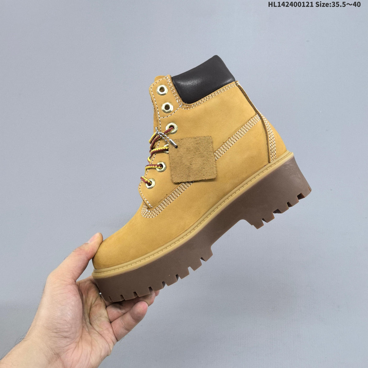 Mid-Top Lace-Up Boots in Wheat by Timberland - product image from the listing.