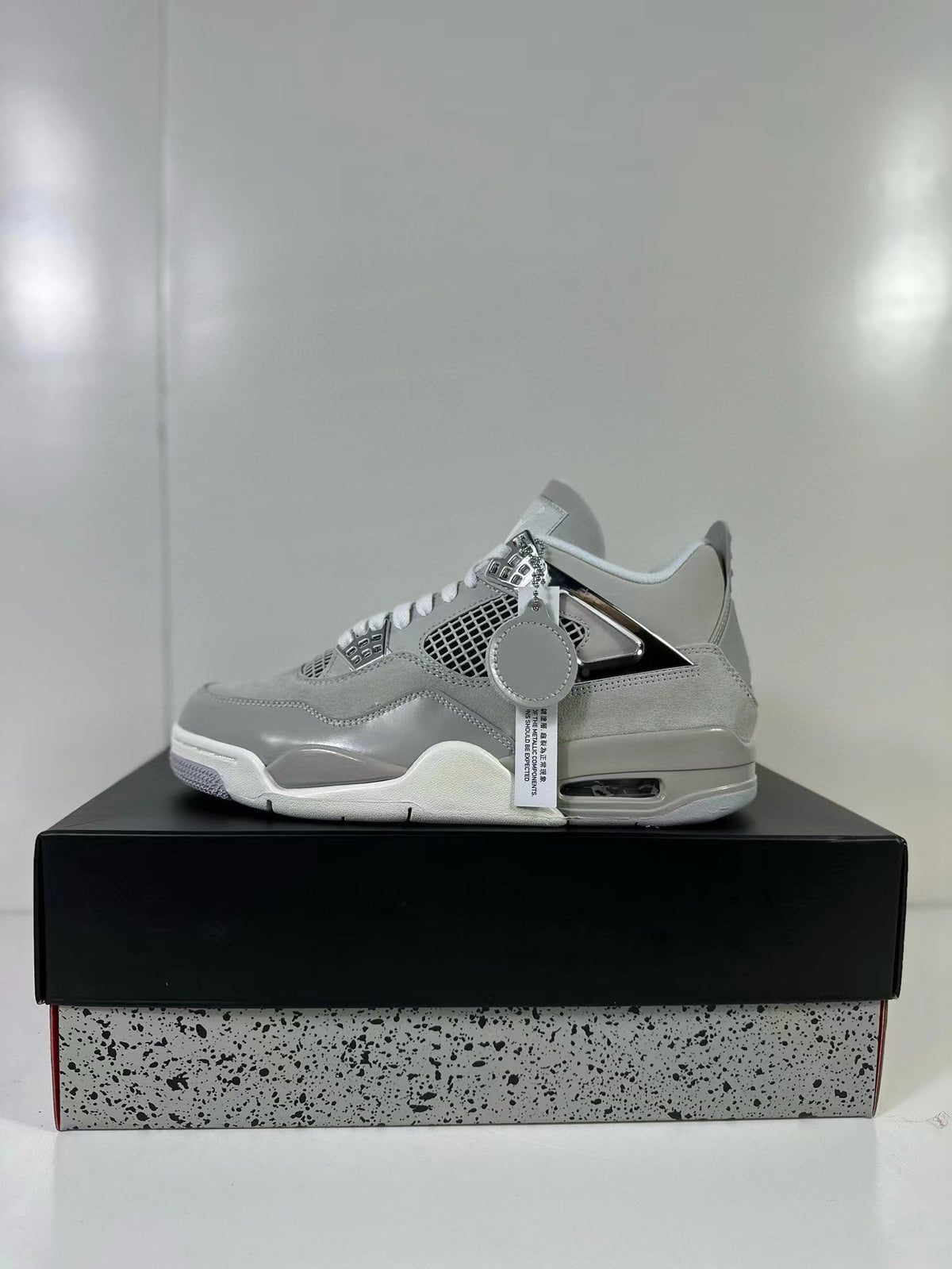 Air Jordan 4 Light Iron Ore Frozen Moments Sneakers - product image from the listing.