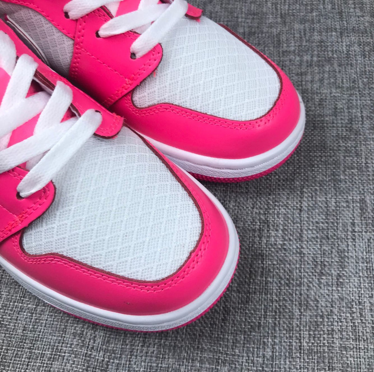 Air Jordan 1 Mid Sneakers in White Pink 555112-611 - product image from the listing.
