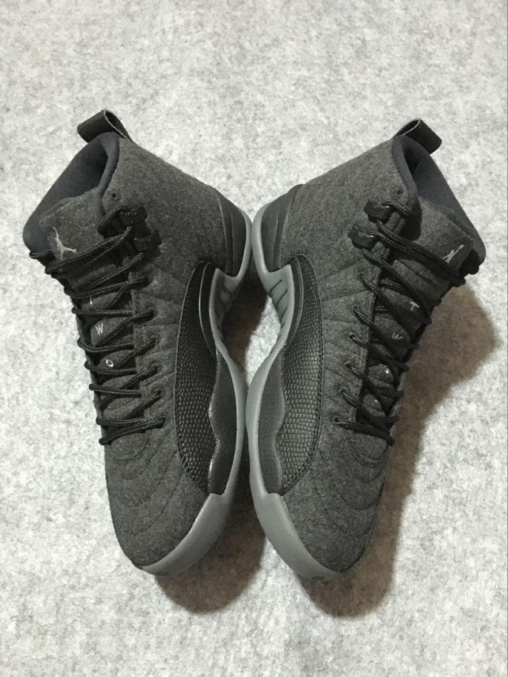 Black and Grey Air Jordan 12 High-Top Sneakers - product image from the listing.