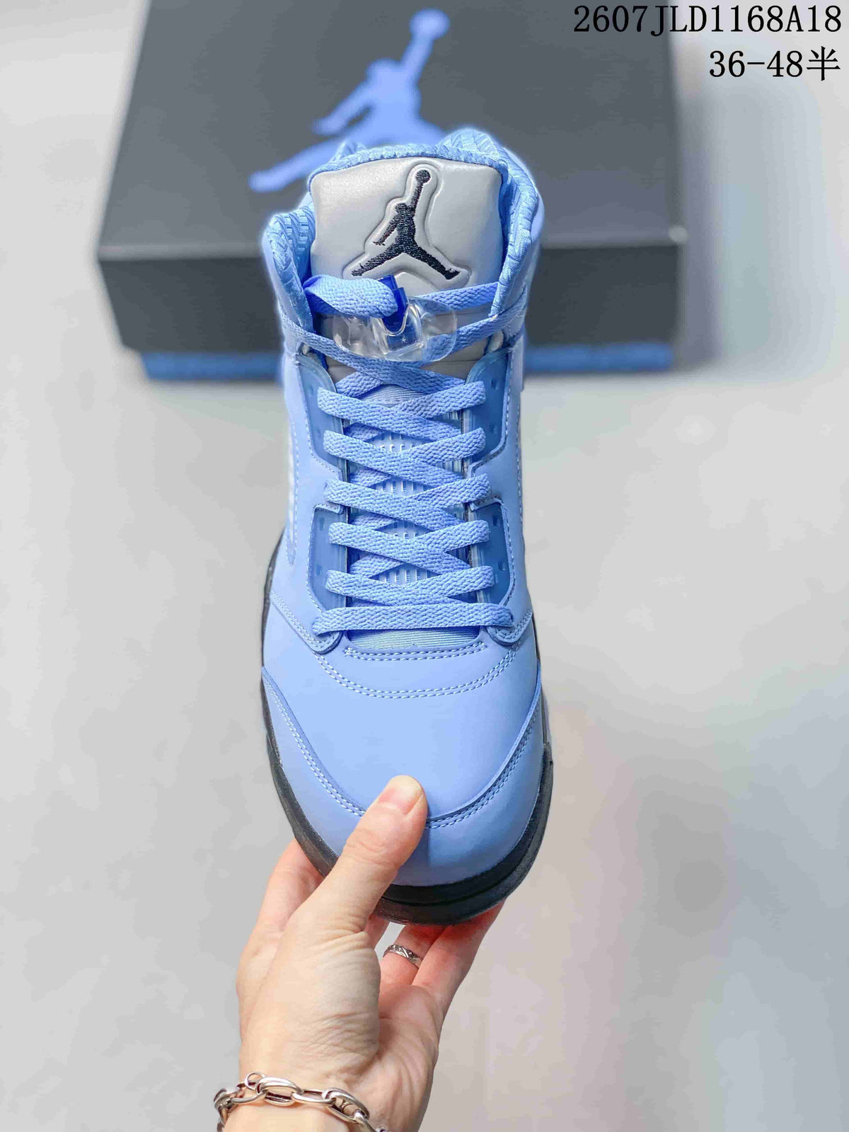 Air Jordan 5 UNC High-Top Sneakers in Blue - product image from the listing.