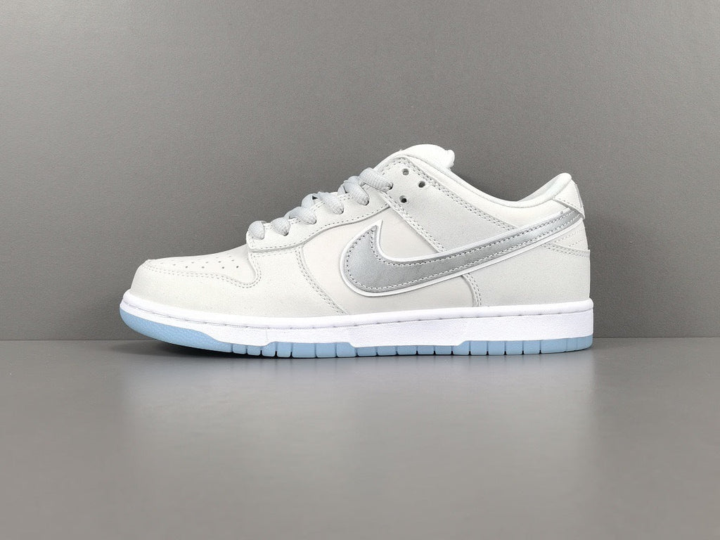 Nike Dunk Low SB Purple Lobster Sneakers in White FD8776-100 - product image from the listing.