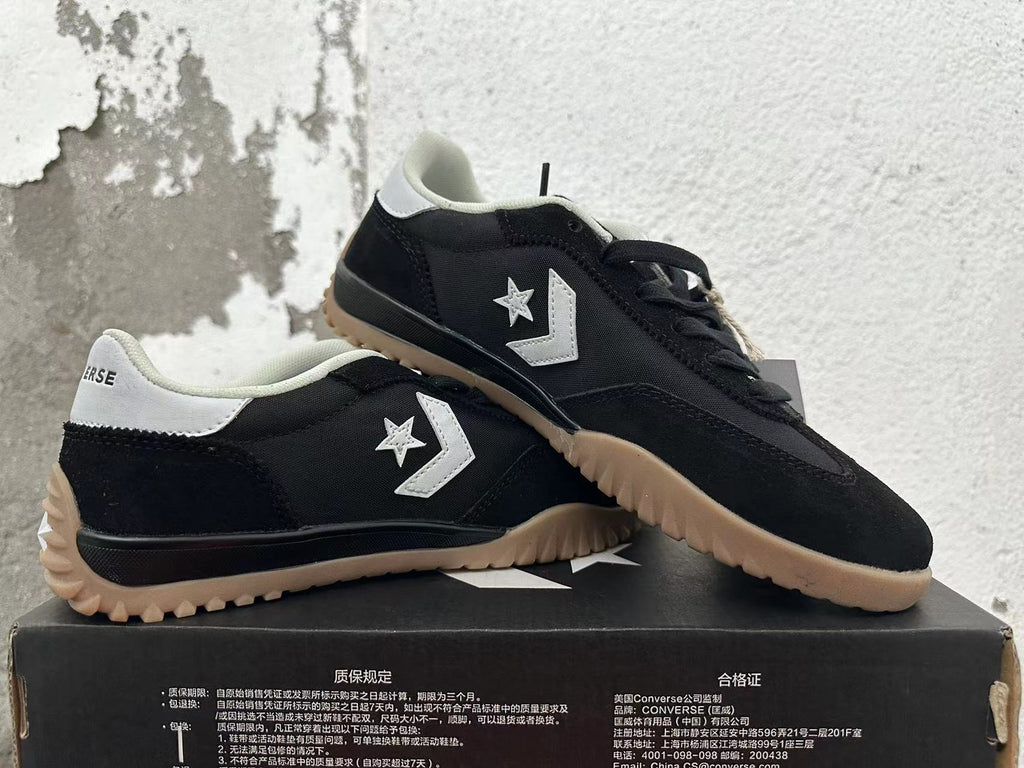 Black and White Converse Trainer-Style Sneakers - product image from the listing.