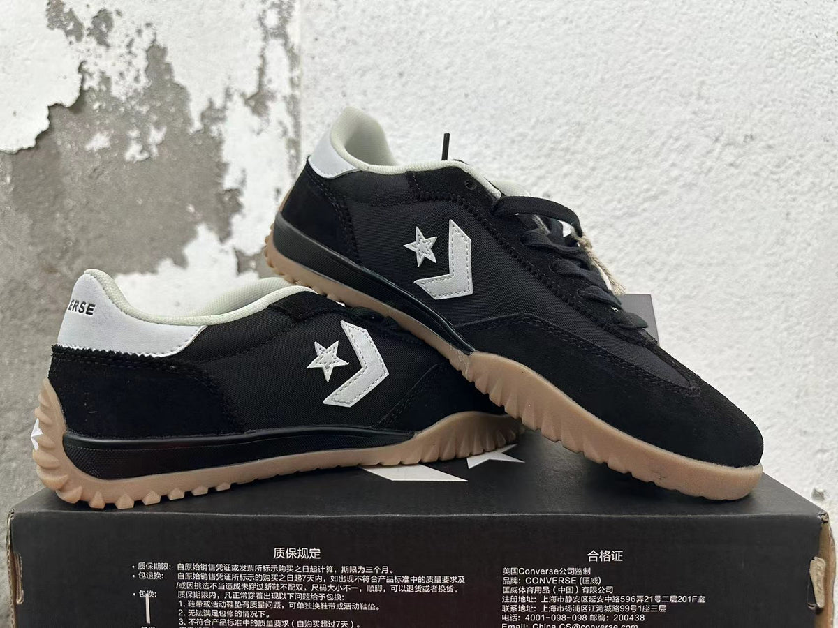 Black and White Converse Trainer-Style Sneakers - product image from the listing.