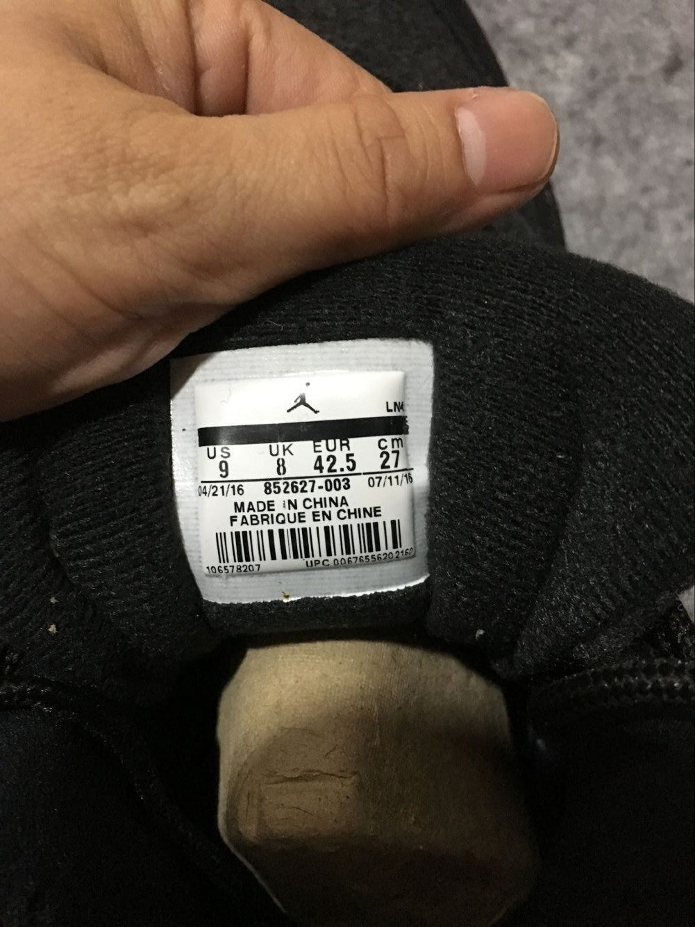 Black and Grey Air Jordan 12 High-Top Sneakers - product image from the listing.
