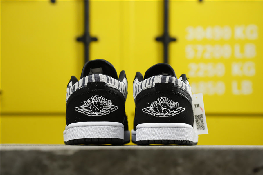 Air Jordan 1 Mid Zebra Print Sneakers Black White - product image from the listing.