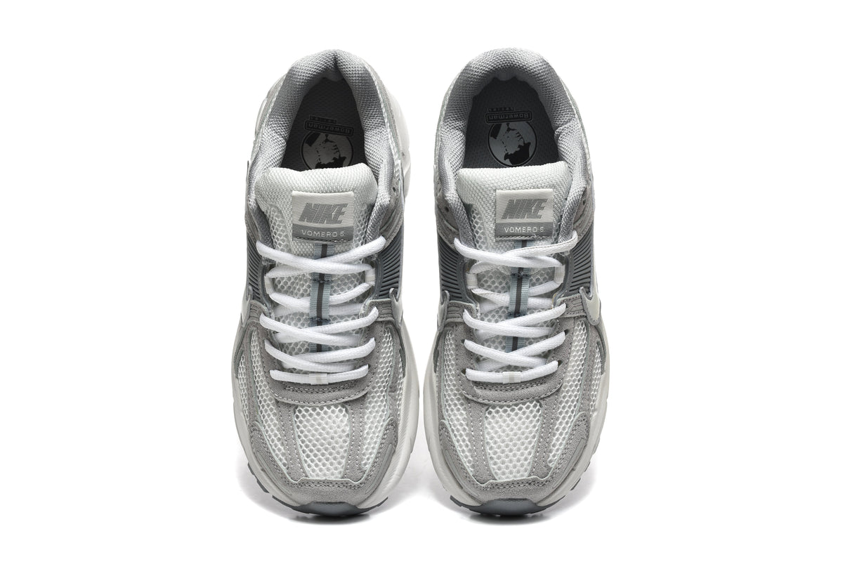 Grey and White Nike Vomero 5 Sneakers - product image from the listing.