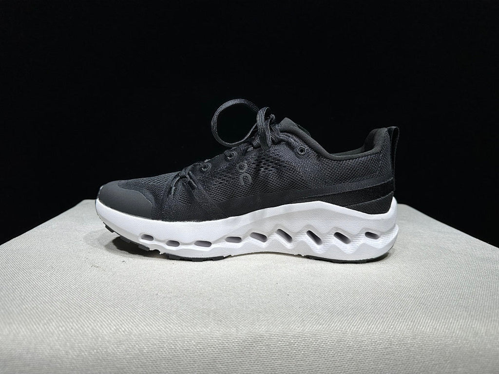 On Cloudsurfer Trail Trail Running Shoes in Black and White - product image from the listing.